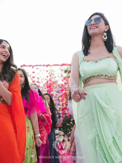 Celebrating one of our own with a vibrant Mehendi on a home terrace. The decor was filled with colorful hanging flowers and lush floral arrangements, creating a joyful setting for lots of dancing and fun.
