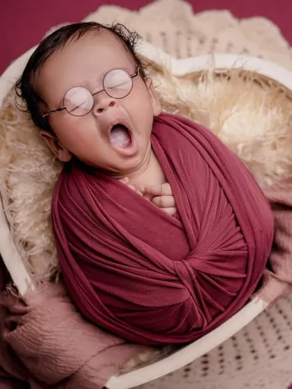 A sleepy yawn from our little genius. I love capturing these candid moments that show the real, adorable personality of your baby.