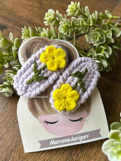 These hairpins feature bright yellow flowers on a lavender base. The color combination is cheerful and perfect for spring and summer looks.