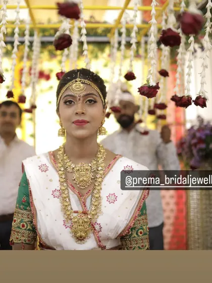 A beautiful shot of the bride under a floral canopy.