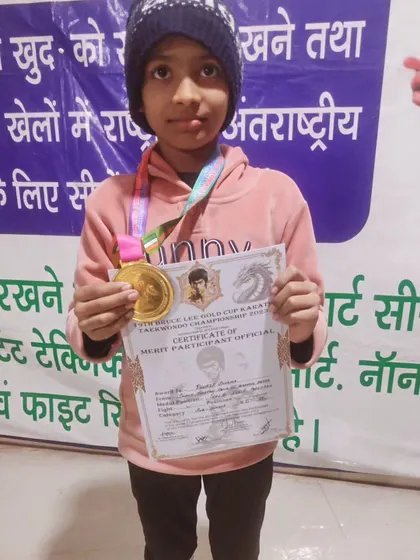 Gold medalist Prerit Sharma. Her success is the result of her mehnat (hard work). In my academy, every student, boy or girl, is trained to be a champion.