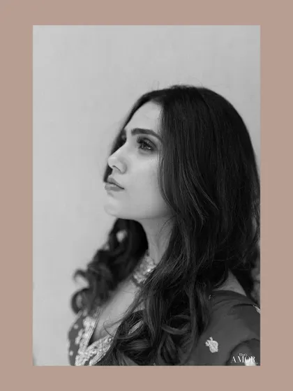 A classic black and white profile portrait of the bride, exuding elegance and grace.