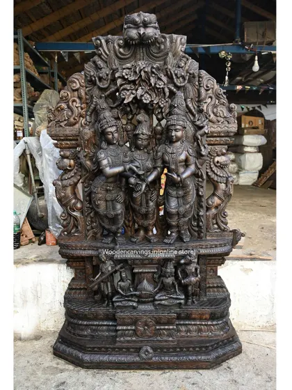 This monumental 87-inch sculpture depicts the Thirukalyana Kolam of Goddess Meenakshi. Carved in a rich, dark wood finish, the piece stands as a testament to our ability to create temple-quality art for grand spaces.
