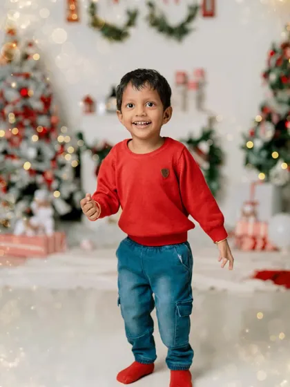 The holiday season through a child's eyes is pure magic. This portrait captures that sense of wonder and happiness, a perfect memory of Christmas time.