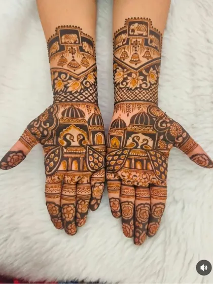 This design features temple dome architecture on both the palms and arms, along with bells and swan motifs, creating a very spiritual and traditional feel.
