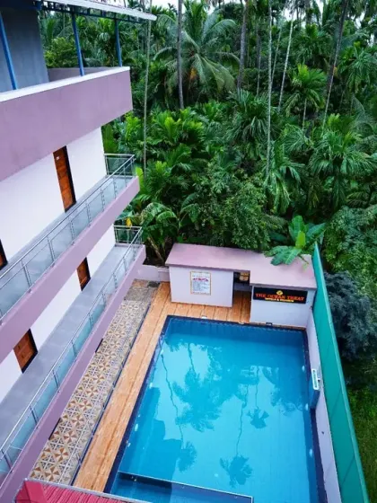 For the hospitality sector, we capture the key selling points of a property. This high-angle shot of The Ocean Treat Hotel in Alibaug showcases its serene pool area nestled among lush palm trees, creating an enticing image for potential guests.