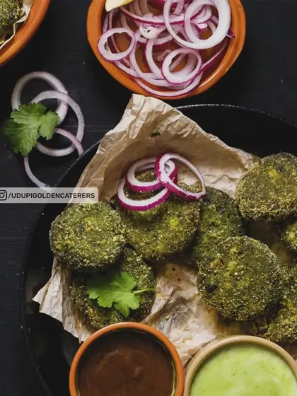 Hara Bhara Kebabs, made from a nutritious blend of spinach, peas, and potatoes. These pan-fried patties are a healthy and delicious vegetarian starter, seasoned with Indian spices and served with dipping sauces.
