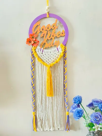 A cheerful and modern wall hanging featuring a "Good Vibes Only" message. I combined a laser-cut wood phrase with yellow and purple macrame for a pop of color and positivity.
