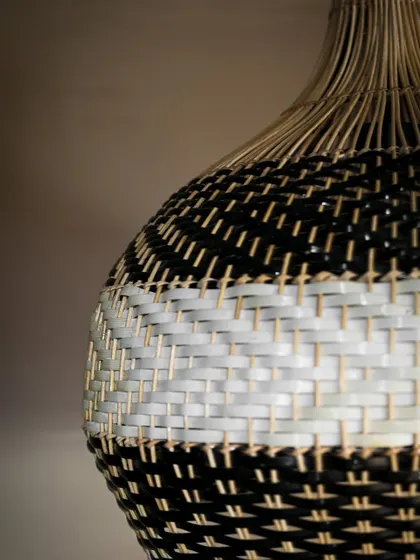 A detailed shot of the two-tone weave. You can see how the different colored fibers are expertly integrated, showcasing the high level of skill required to create this seamless, patterned effect.