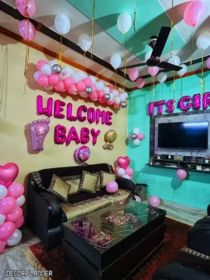 Another perspective of the full room decoration, showing how every corner is filled with celebratory touches. It’s all about creating a magical first impression for the baby and her family.