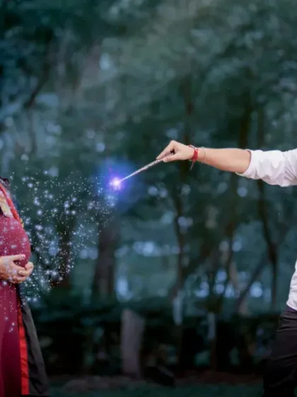 Wingardium Leviosa! A little bit of magic and a whole lot of love. This creative maternity photo captures the playful spirit of this couple as they await their little wizard.