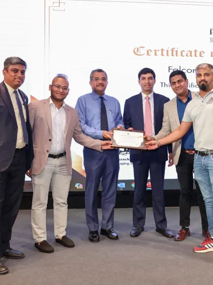 Accepting a certificate with my colleagues. Teamwork is at the core of our success, ensuring a smooth and professional experience for our clients from start to finish.