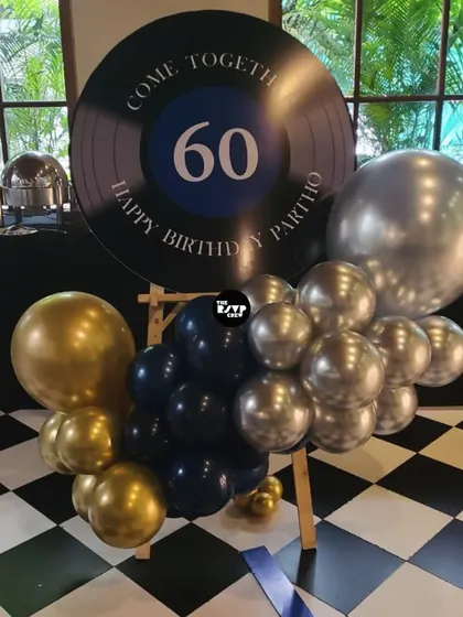 A stylish welcome sign designed to look like a vinyl record, perfect for a music-themed 60th birthday party.
