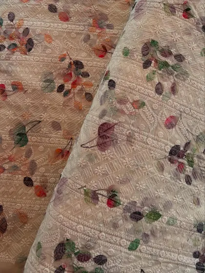 This embroidered cotton fabric with a printed floral design is a beautiful example of how we layer texture and color for a unique look.
