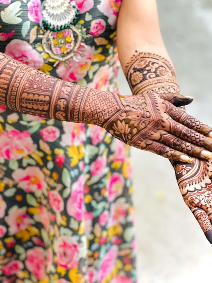 A side view of the full-arm design, giving a glimpse of the intricate patterns that wrap around the arm.