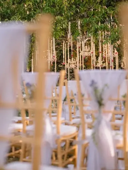 A view of the elegant wedding ceremony seating, with chairs looking towards the mandap.