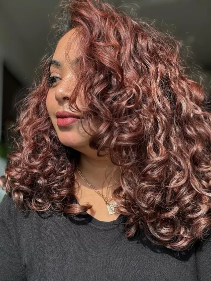 A collection of my other no-bleach balayage and color work, showcasing a variety of tones from subtle browns to vibrant reds on different curl types.