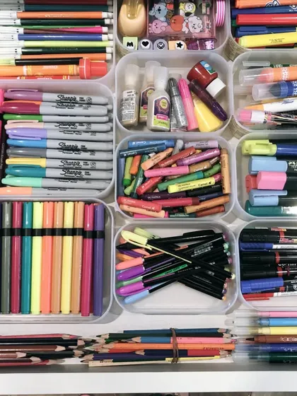 This art supply drawer is a creative's paradise. We used clear trays to neatly categorize pens, markers, and crayons, making it easy to find the right color for any project.