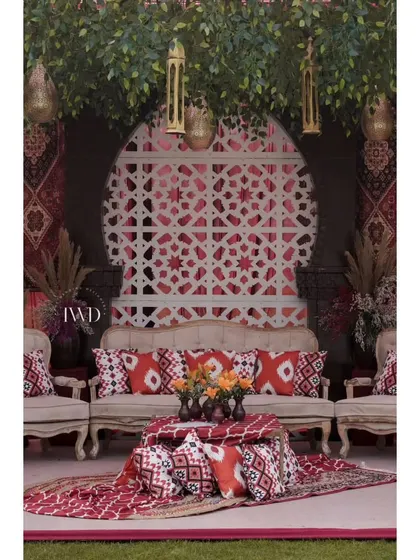 For this Mehendi, we created a 'Souk at Fatehpur' theme. The seating area featured rich textiles, traditional prints, and intricate lattice work, transporting guests to a Moroccan market.