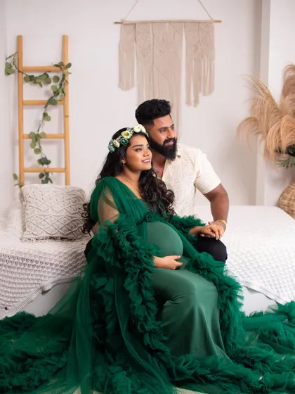A gorgeous couple's portrait in our boho studio, the rich green gown and floral crown creating an earthy, goddess-like vibe.