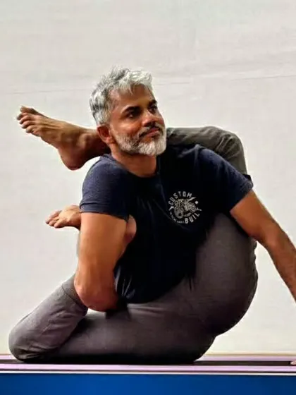This complex posture combines a deep hip opening with a twist, requiring flexibility in the hips, spine, and shoulders. Poses like these are the focus of our advanced workshops, where we explore the limits of the body safely.