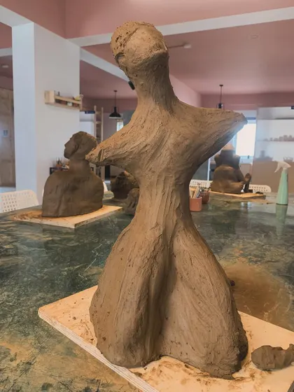 An abstract sculpture created by a student during our workshop. The organic, flowing form is a testament to the creative freedom that clay offers.