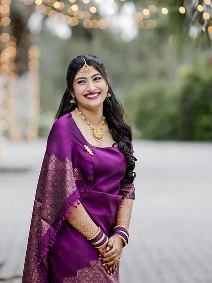 A happy, smiling portrait of the bride. The outdoor lighting makes her skin look extra radiant.