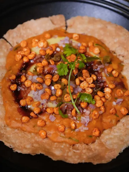 My version of Dal Pakwan. A crispy, large pakwan forms the base for hearty dal, topped with a zing of jalapeño and the crunch of kachumber.