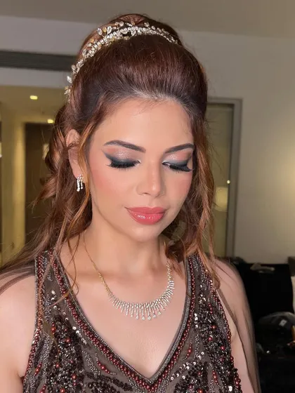 The finished cocktail glam look. The sharp, winged eyeliner and glossy pink lips are a perfect combination for a night of glamour.