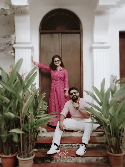 A stylish shot of the couple posing on steps, exuding a cool and confident vibe.