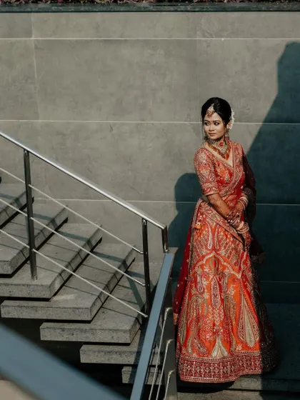 We use modern architecture to create stunning compositions. The bride on the staircase is a classic pose, but the clean lines and shadows give it a contemporary, graphic feel.