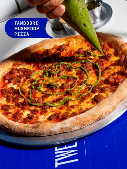 My Tandoori Mushroom Pizza is a fusion of flavours. The earthy mushrooms are marinated in tandoori spices and drizzled with a vibrant mint chutney for a unique Indian-inspired pizza.