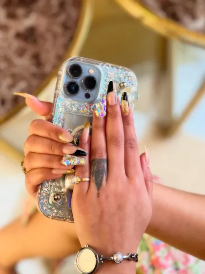 This final view of the 3D nail art demonstrates the durability and artistry of our extensions. Even with intricate designs and embellishments, we ensure a flawless and long-lasting finish.