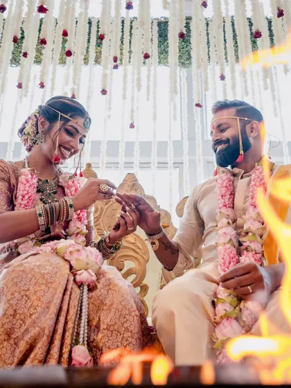 A beautiful moment by the sacred fire. The couple's happy smiles are illuminated by the flames, with our floral decor creating a soft and romantic ambiance.