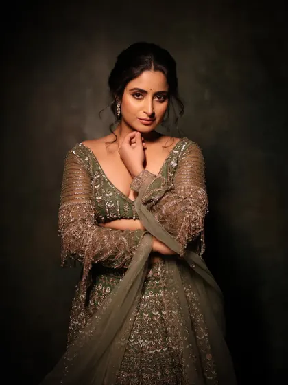 A beautiful portrait that captures the soft, elegant mood of the shoot. The makeup enhances her features with a gentle glow, creating a timeless and sophisticated look.