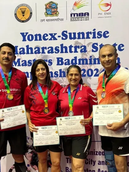 The winners and runners-up of a mixed doubles event, all smiles with their medals and certificates.