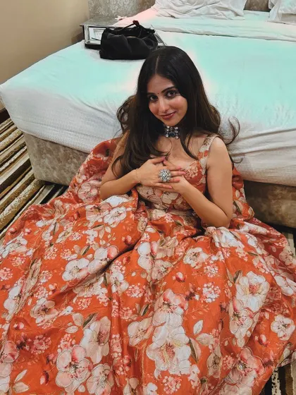 A playful shot of the client in her floral lehenga.