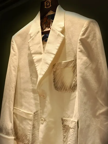 A closer look at the hand-sketched details on this unique jacket. The raw, artistic feel is perfect for a man who appreciates modern design and craftsmanship.