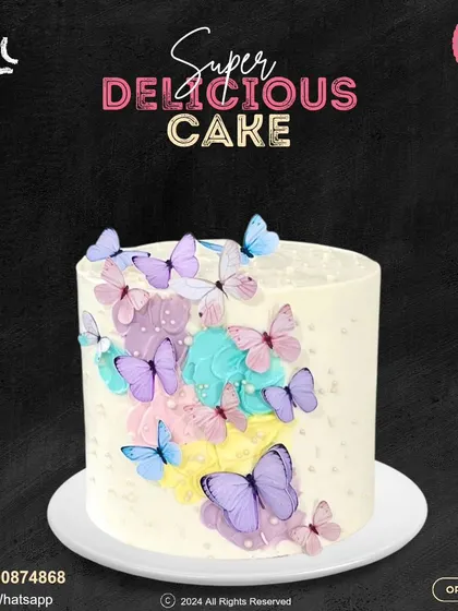 A whimsical cake covered in a flight of colorful butterflies. The pastel smudges of color on the white buttercream create a beautiful canvas for the delicate edible butterflies.