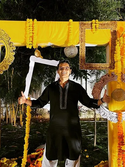 Posing at a Haldi ceremony photo booth. I love soaking in the festive atmosphere of all the different wedding functions I get to be a part of.