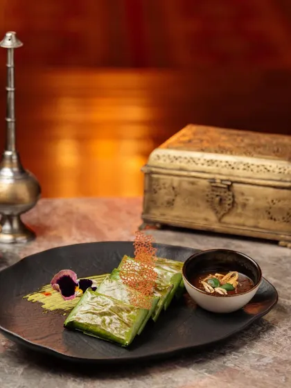 This dish of fish wrapped in a banana leaf is an example of the thought and experience I put into every plate, blending tradition with modern presentation.