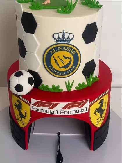 A view of the back of the two-tiered cake, showing the Formula 1 and Ferrari branding on the bottom tier.