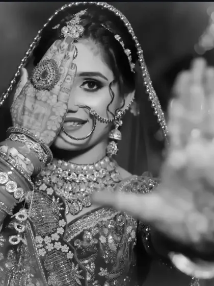A classic black and white photo that beautifully highlights the intricate patterns of the bridal mehndi.