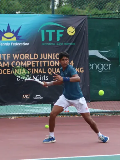 Tavish Pahwa preparing to hit a backhand during the ITF World Junior Team Competition. His solid stance and preparation are fundamentals we drill daily.