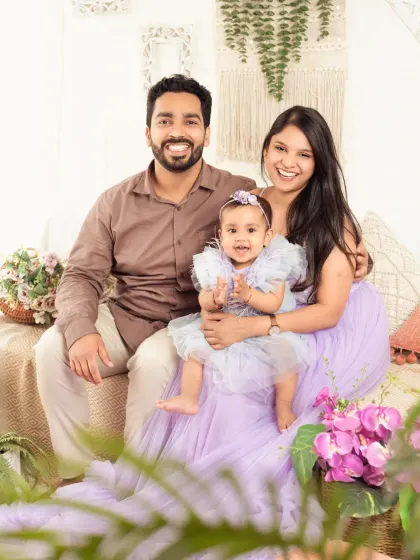 A happy family of three, perfectly coordinated in lovely pastel colors in our boho studio.
