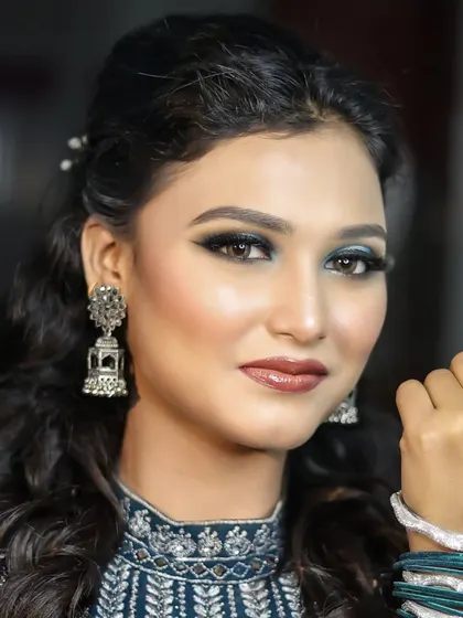 A full-face portrait showcasing the blue smokey eye, paired with a neutral lip to keep the focus on the eyes.