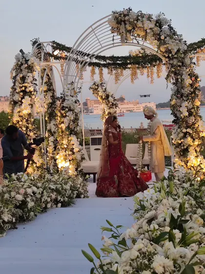 The varmala ceremony set against the beautiful backdrop of Lake Pichola in Udaipur. We are experienced in coordinating entertainment for events at exclusive and logistically complex venues.