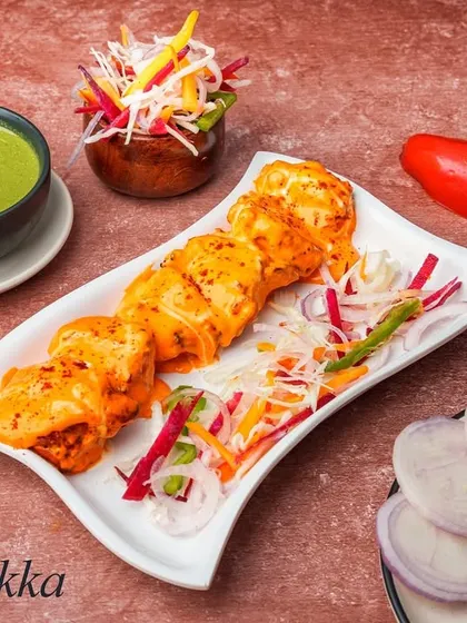 Our Barra Tikka features tender pieces of chicken marinated in our special barra sauce and grilled in the tandoor. The sauce gives it a unique, tangy, and moderately spicy flavor profile.