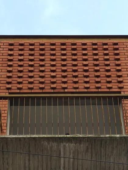 The texture of the brickwork is a key feature of this building's exterior, adding visual interest and a rustic touch to the contemporary form.