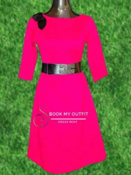 This bright pink dress, shown on a mannequin, features three-quarter sleeves and a wide, sparkling belt. It's a cheerful and stylish option for a party or special event.